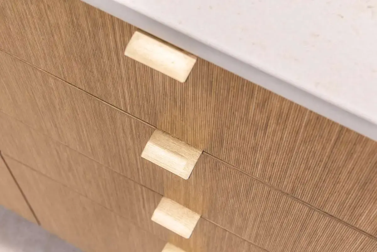 Wild brown birch veneer cabinet fronts and white ceramic worktops