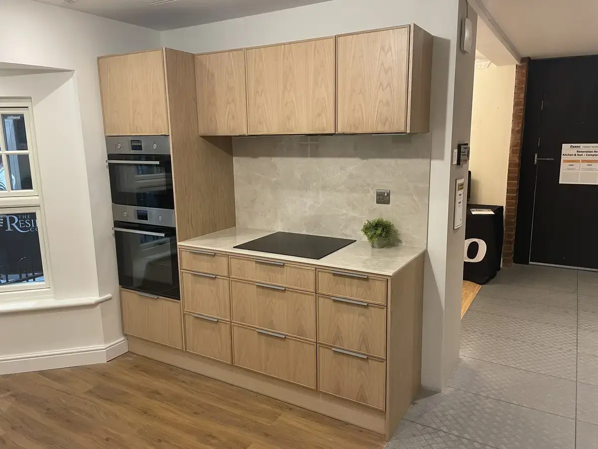 sustique supplied puustelli miinus kitchen showing tall oven housing, base drawer units, and wall units